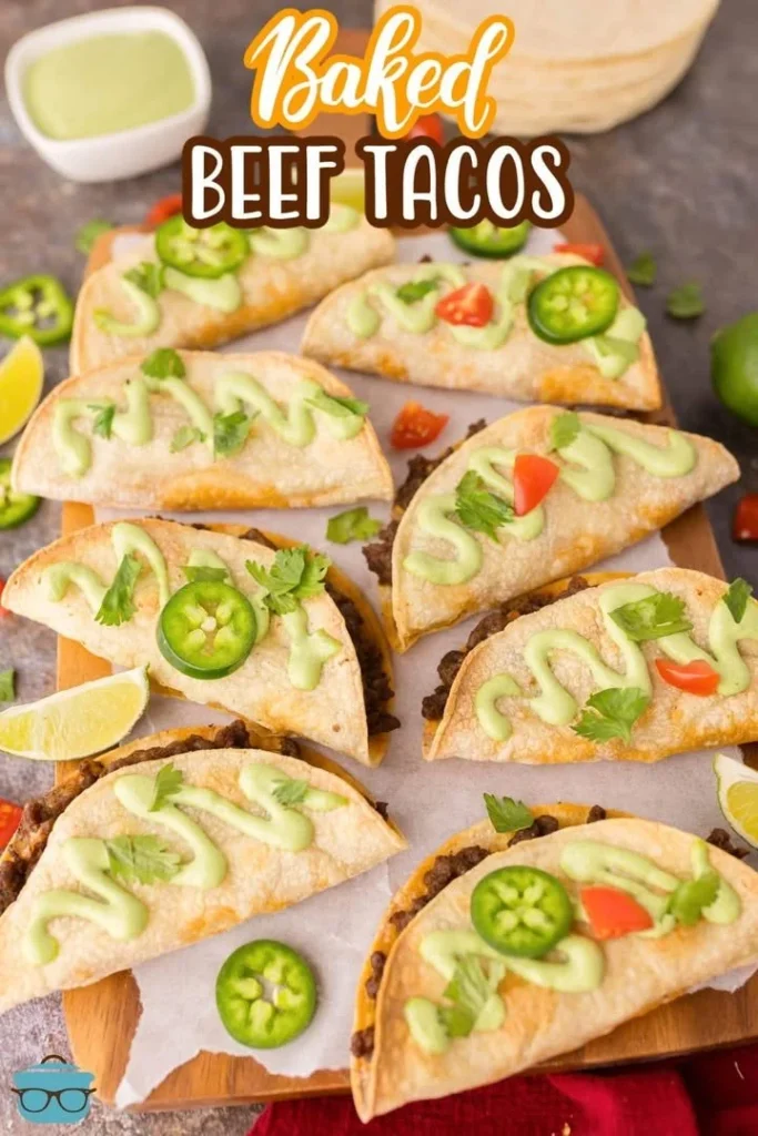 Delicious baked beef tacos topped with cheese and fresh ingredients