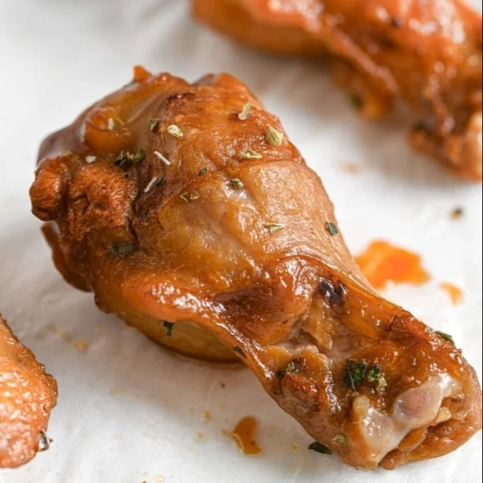 Delicious baked chicken wings served with dipping sauce