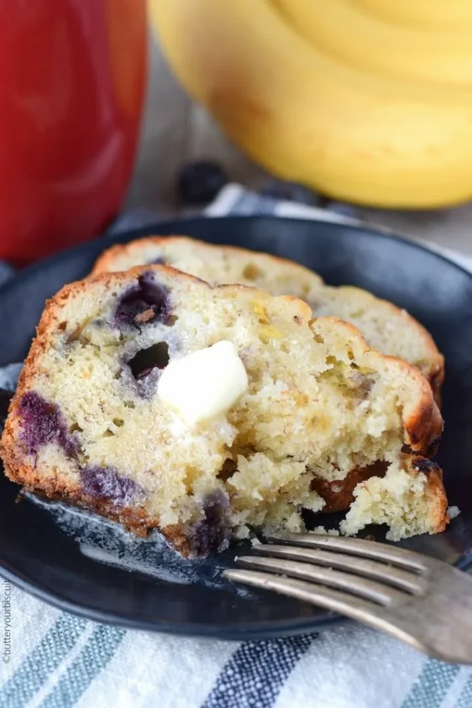 Freshly baked Banana Blueberry Bread on a wooden table