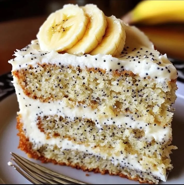 Delicious banana bread cake adorned with cream cheese frosting.