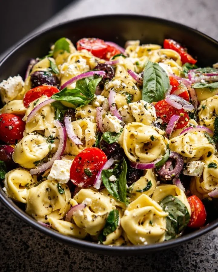 Basil Feta Tortellini Pasta Salad with Lemon Vinaigrette served in a bowl