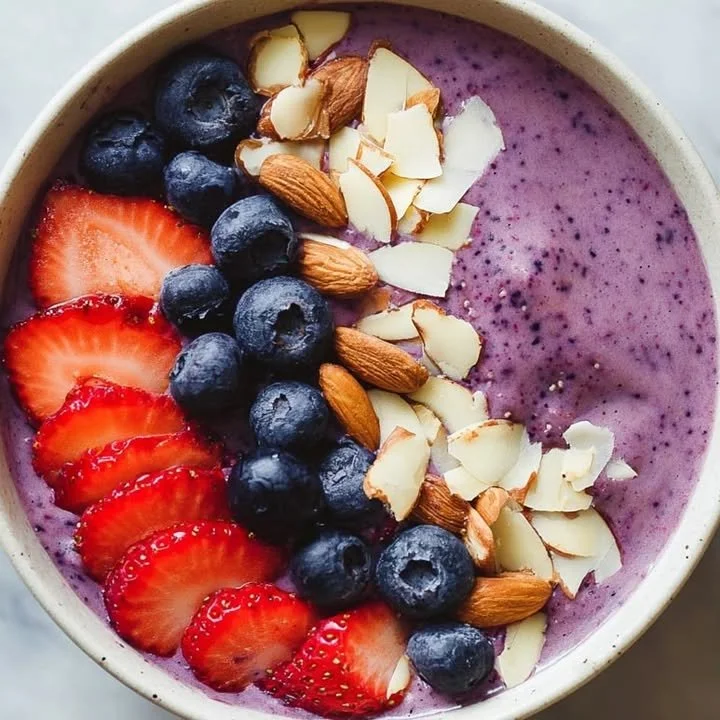 Berry Almond Smoothie Bowl topped with fresh berries and almonds