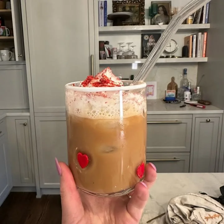 Berry Chantilly Latte topped with fresh berries and whipped cream