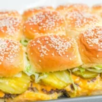 Serving of Big Mac sliders garnished with fresh ingredients
