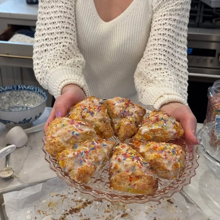 Delicious birthday cake scones topped with colorful sprinkles on a plate