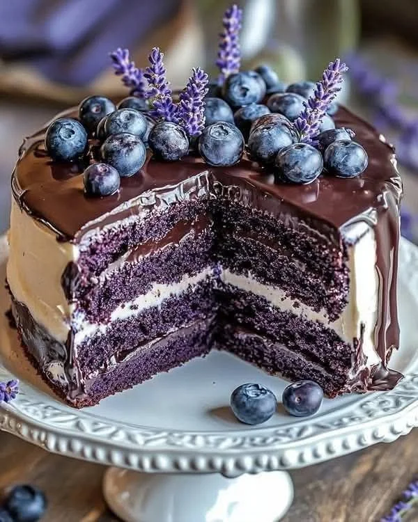 Delicious Blueberry Chocolate Lavender Cake with fresh blueberries and lavender flowers
