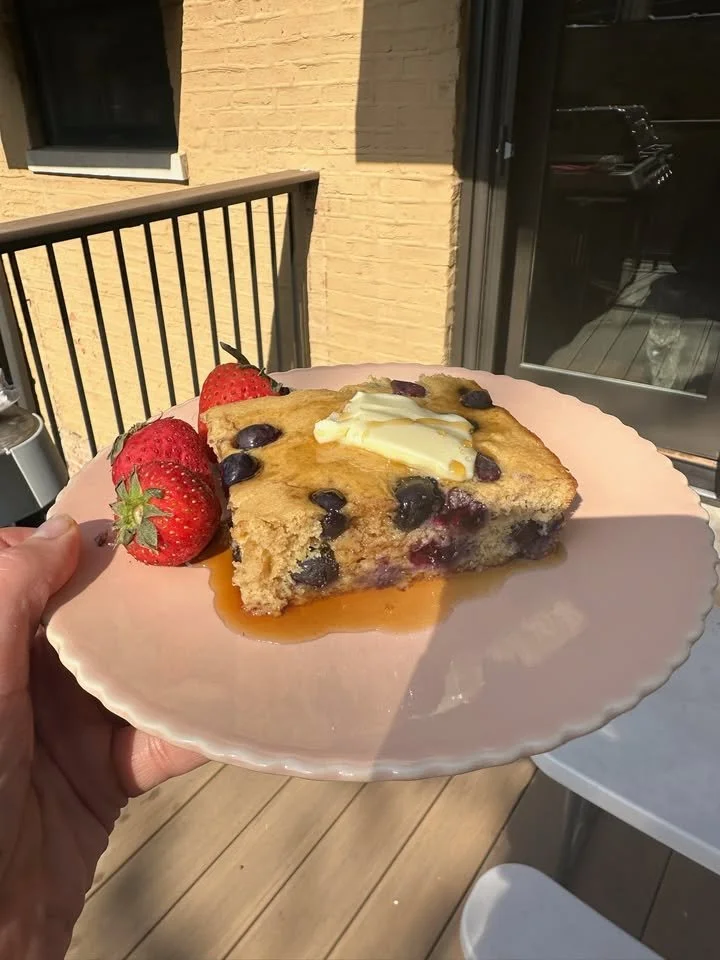 Blueberry protein pancakes stacked in a fluffy breakfast cake