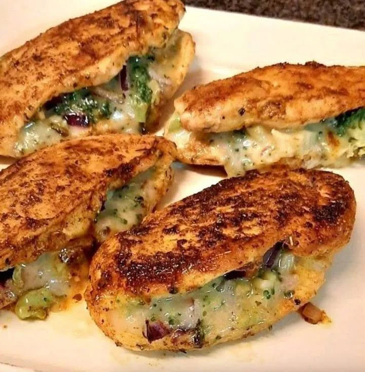 Broccoli cheese stuffed chicken breasts plated and garnished