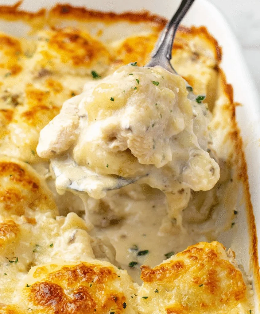 Cheesy Chicken Ravioli Bake topped with melted cheese and herbs