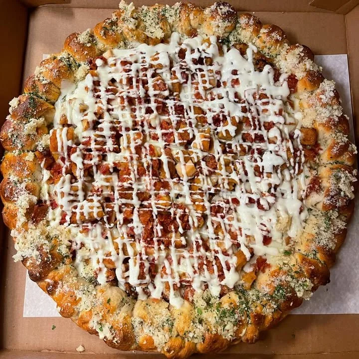 Delicious Chicken Bacon Ranch Pizza topped with chicken, bacon, and ranch dressing