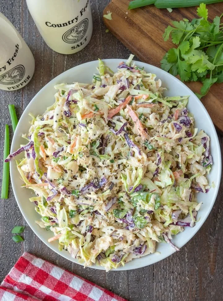 A bowl of Chipotle Lime Coleslaw with colorful vegetables and lime dressing