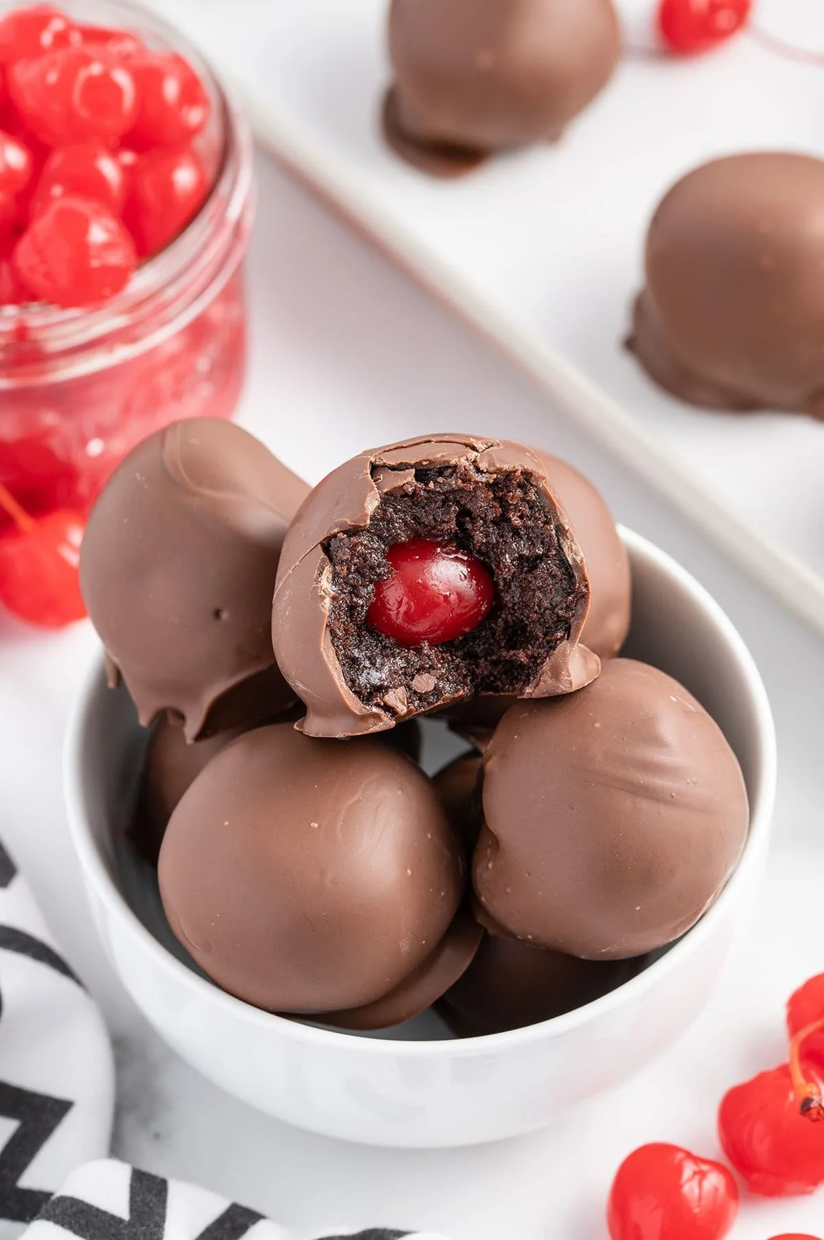 Decadent chocolate covered cherry brownie bombs ready to delight your taste buds.