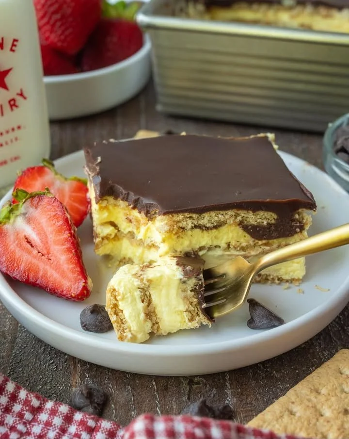 Delicious Chocolate Eclair Cake layered with chocolate cream and pastry.