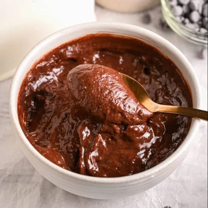 Delicious chocolate protein spread jar with a spoon