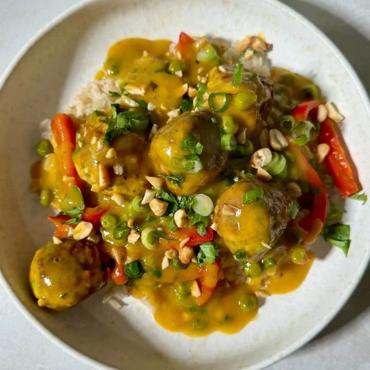 Cilantro chicken meatballs served in mango coconut sauce