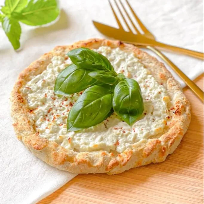 Cottage Cheese Pizza topped with fresh vegetables and herbs