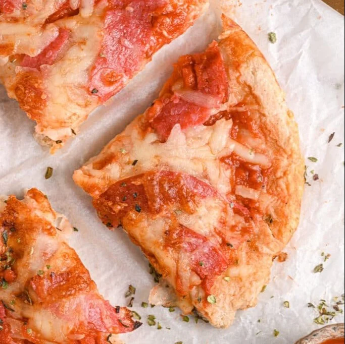 Homemade Cottage Cheese Pizza topped with fresh vegetables and herbs