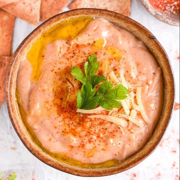 Delicious cottage cheese queso served with tortilla chips and fresh vegetables