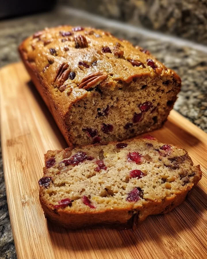 Loaf of cranberry pecan whole wheat bread freshly baked