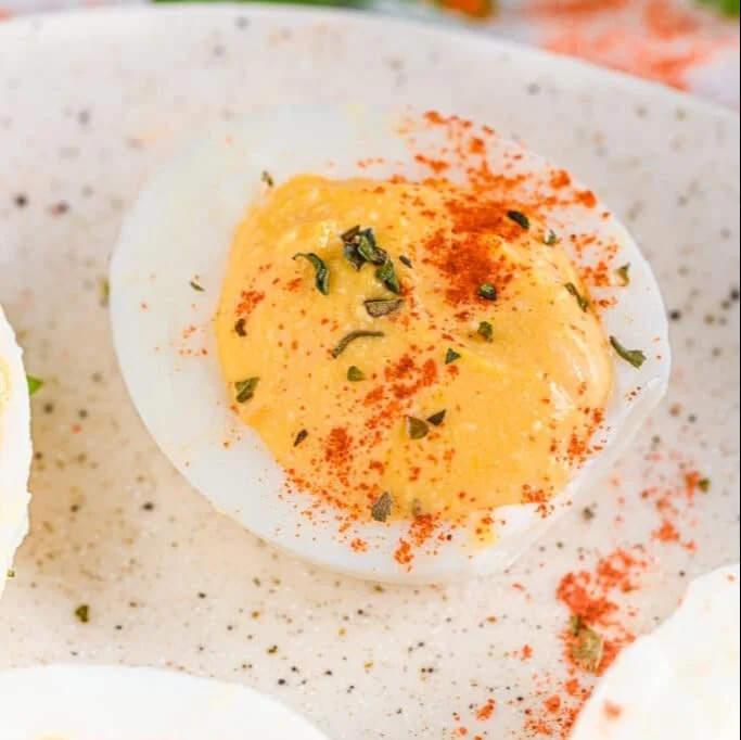 Creamy deviled eggs made with cottage cheese, garnished and ready to serve.