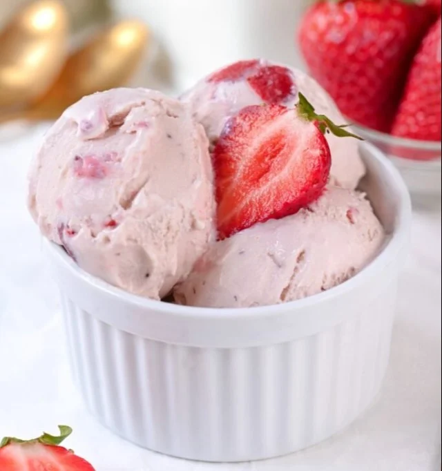 Delicious creamy frozen yogurt served in a colorful cup with various toppings