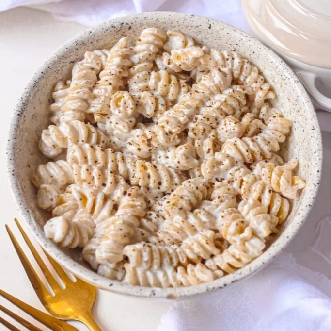 Creamy Greek yogurt pasta sauce served over pasta in a bowl