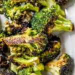Crispy caramelized grilled broccoli served on a plate