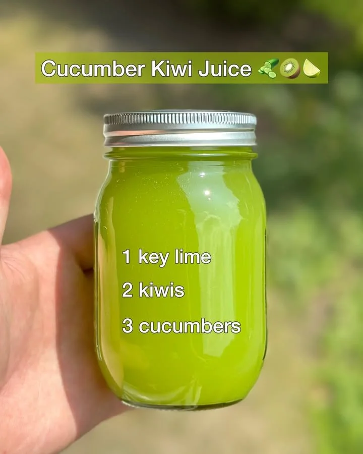 Fresh cucumber kiwi juice in a glass with garnishes