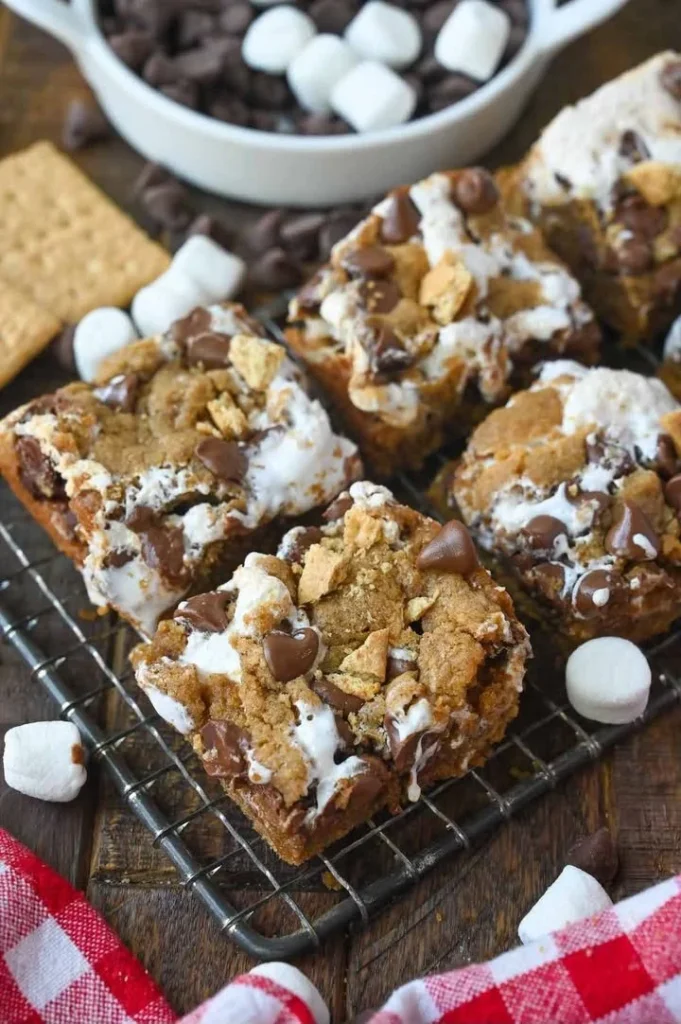 Delicious and easy s'mores cookie bars topped with chocolate and marshmallows