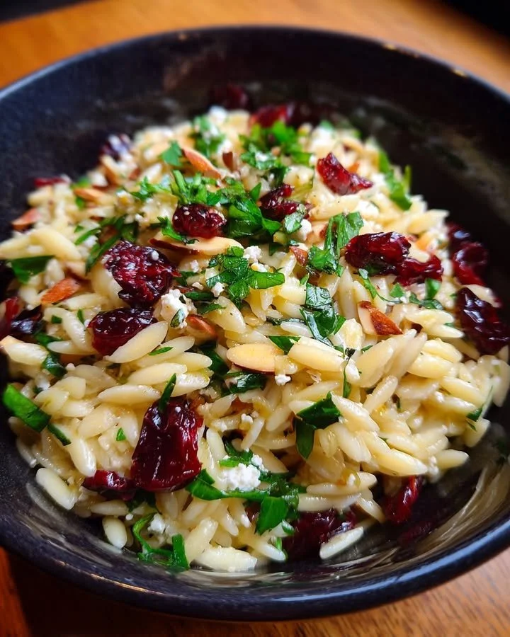 Feta cranberry orzo salad with lemon vinaigrette in a bowl