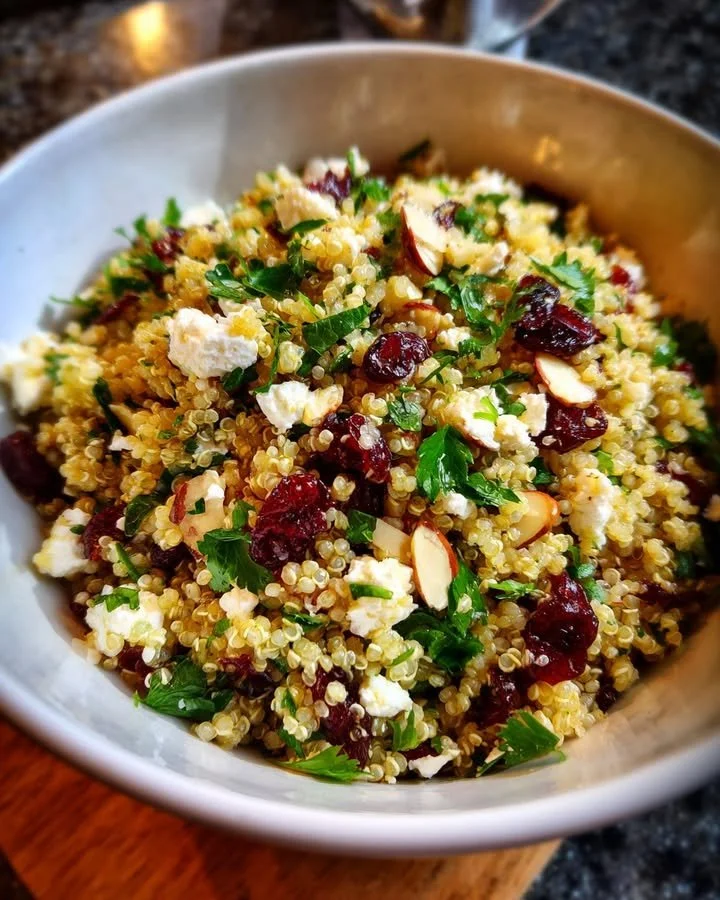 Feta and cranberry quinoa salad with lemon vinaigrette in a bowl