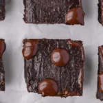 Delicious flourless Greek yogurt brownies topped with chocolate drizzle