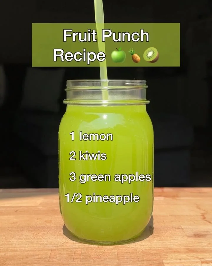 Delicious and colorful fruit punch served in a glass with fresh fruits
