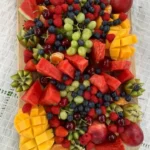 A colorful assortment of fresh fruits including apples, oranges, and berries.