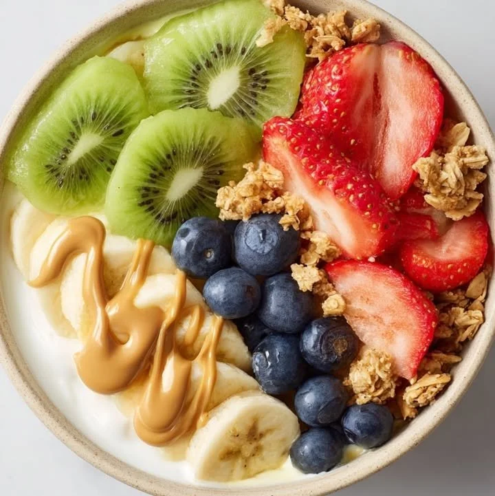 Delicious fruity yogurt bowl topped with fresh berries and granola