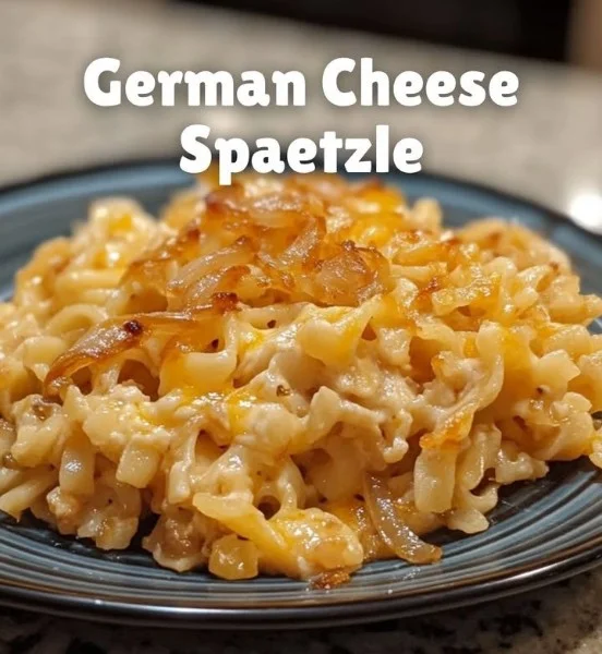 Plate of German cheese noodles topped with herbs and melted cheese