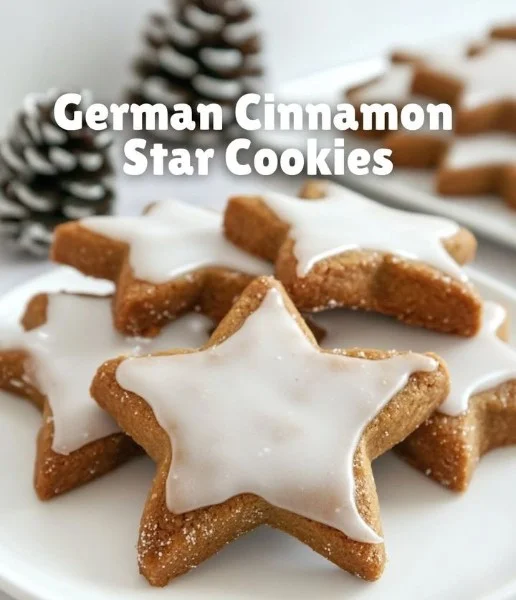 Decorated German cinnamon star cookies on a festive plate