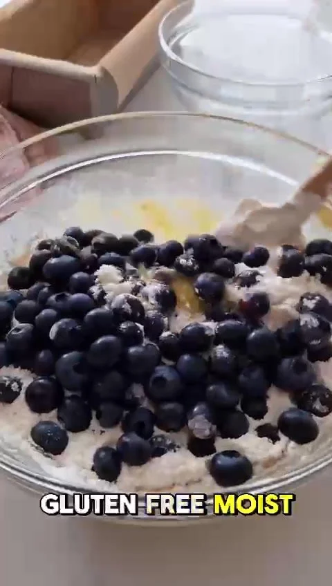 Freshly baked gluten-free blueberry loaf with moist texture and berries