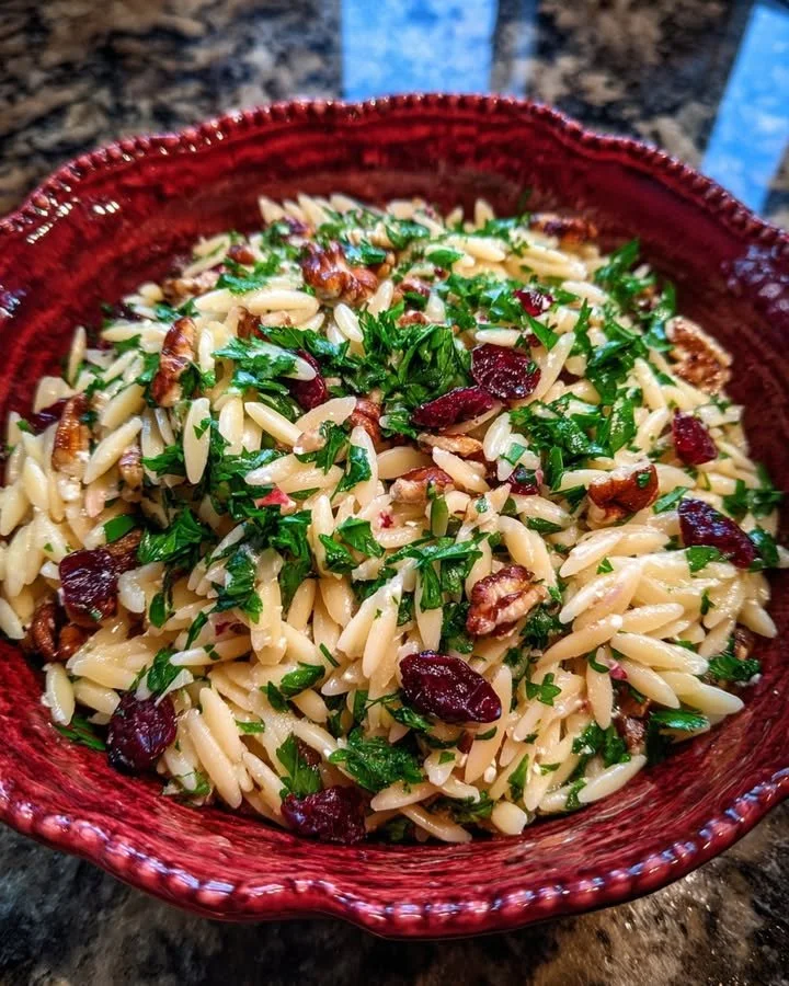 Goat Cheese Orzo Salad with cranberries and lemon vinaigrette on a plate