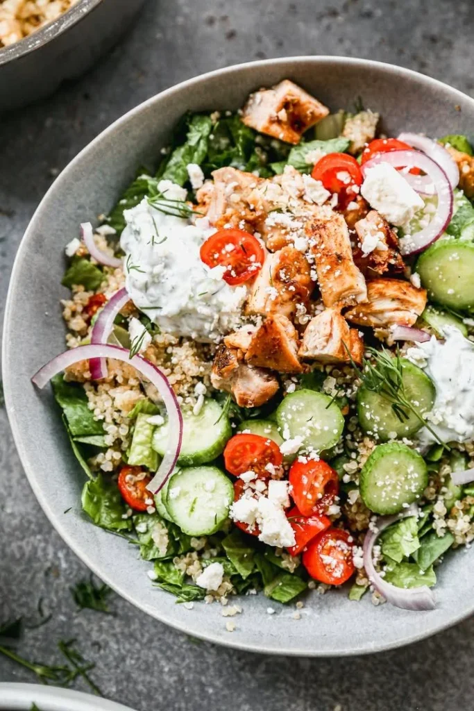 Delicious Greek Chicken Bowl with fresh vegetables and herbs