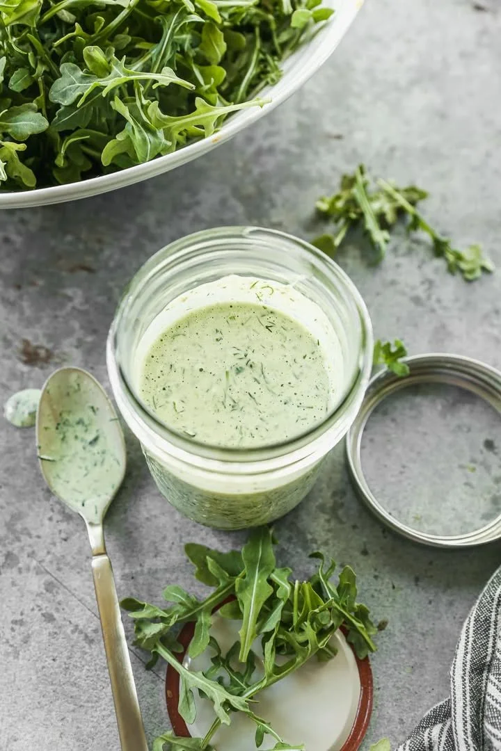 Creamy Green Goddess Dressing made with fresh herbs and avocado.