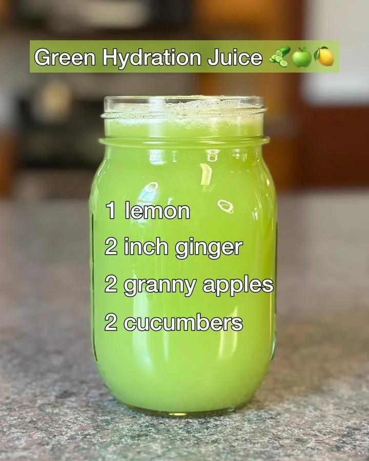 Glass of refreshing green hydration juice made from fresh vegetables and fruits.