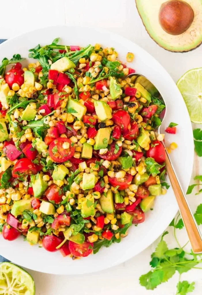 Delicious grilled corn salad topped with fresh avocado and herbs