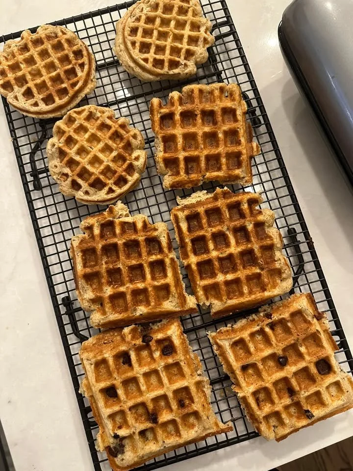 High protein waffles stacked with fresh toppings and syrup