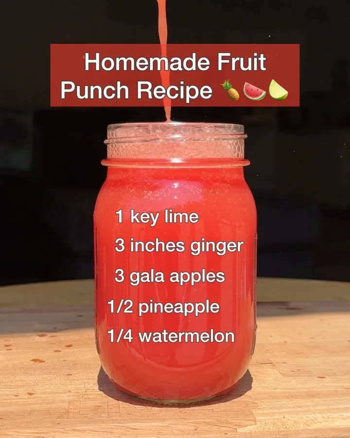 Homemade fruit punch in a glass with fresh fruits and ice