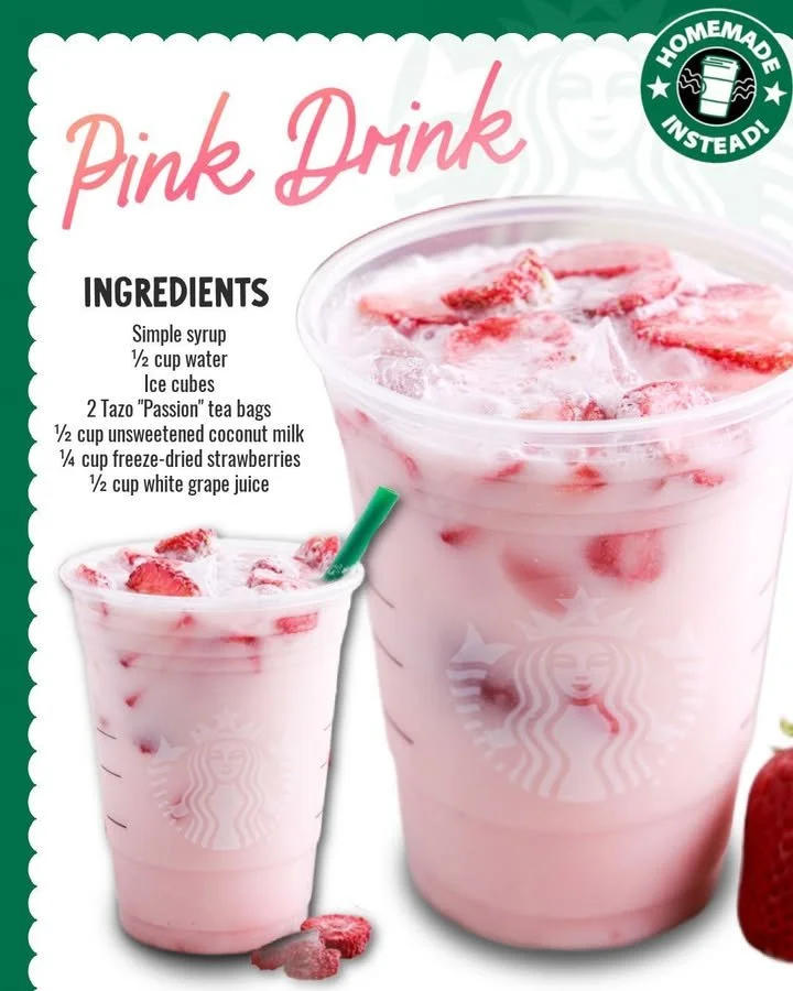 A refreshing homemade pink drink served in a glass with ice and strawberries.
