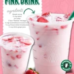 Refreshing homemade pink drink served in a glass with ice and berries