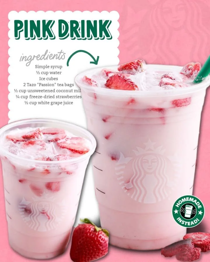 Refreshing homemade pink drink served in a glass with ice and berries
