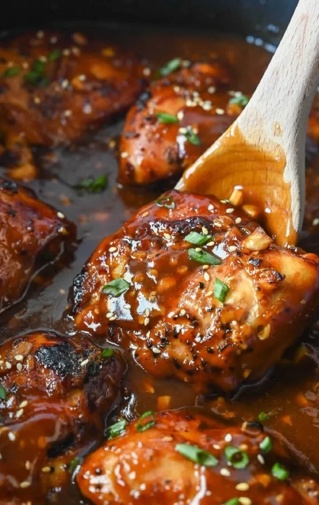 Honey Garlic Slow Cooker Chicken served on a plate with garnish