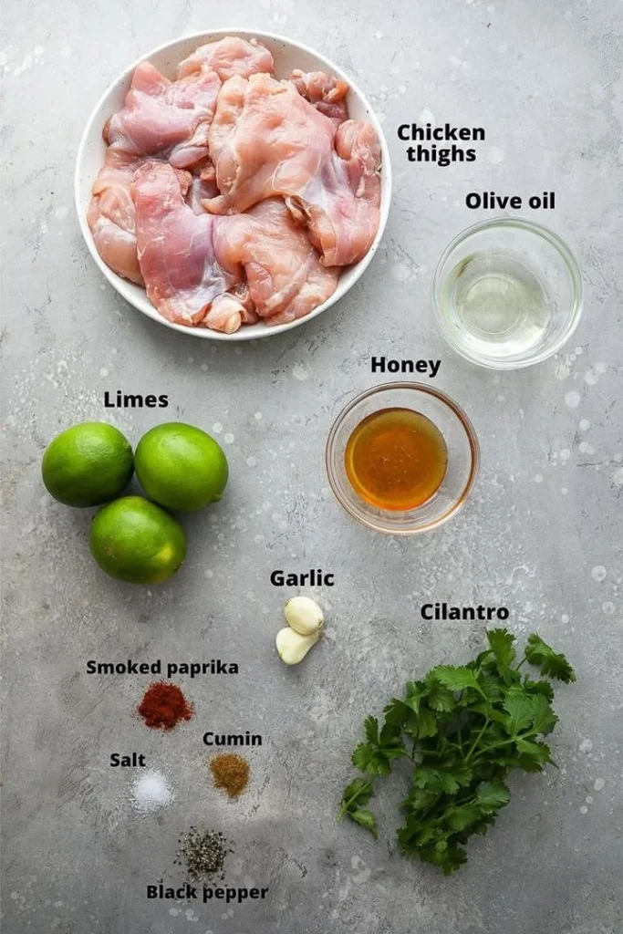 Honey lime grilled chicken thighs on a grill, marinated and ready to enjoy.